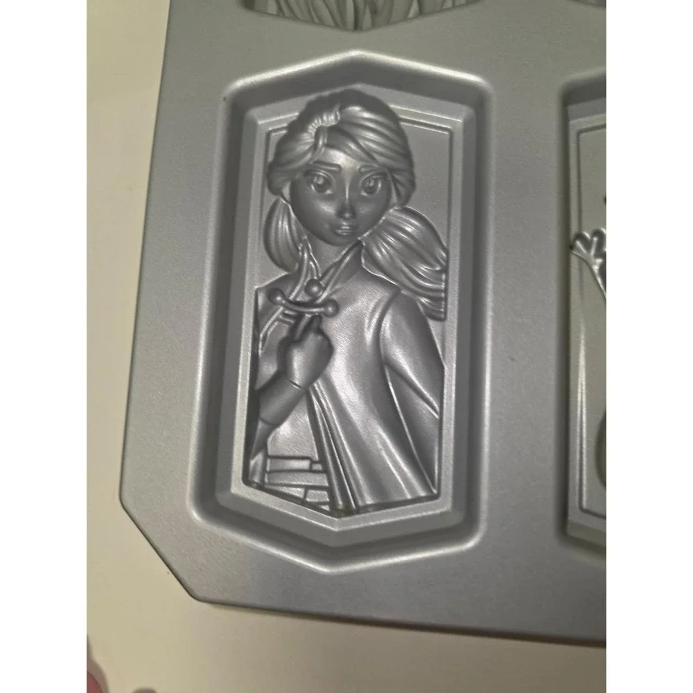 Nordic Ware Disney Frozen 2 character cakelet pan is made of heavy cast aluminum